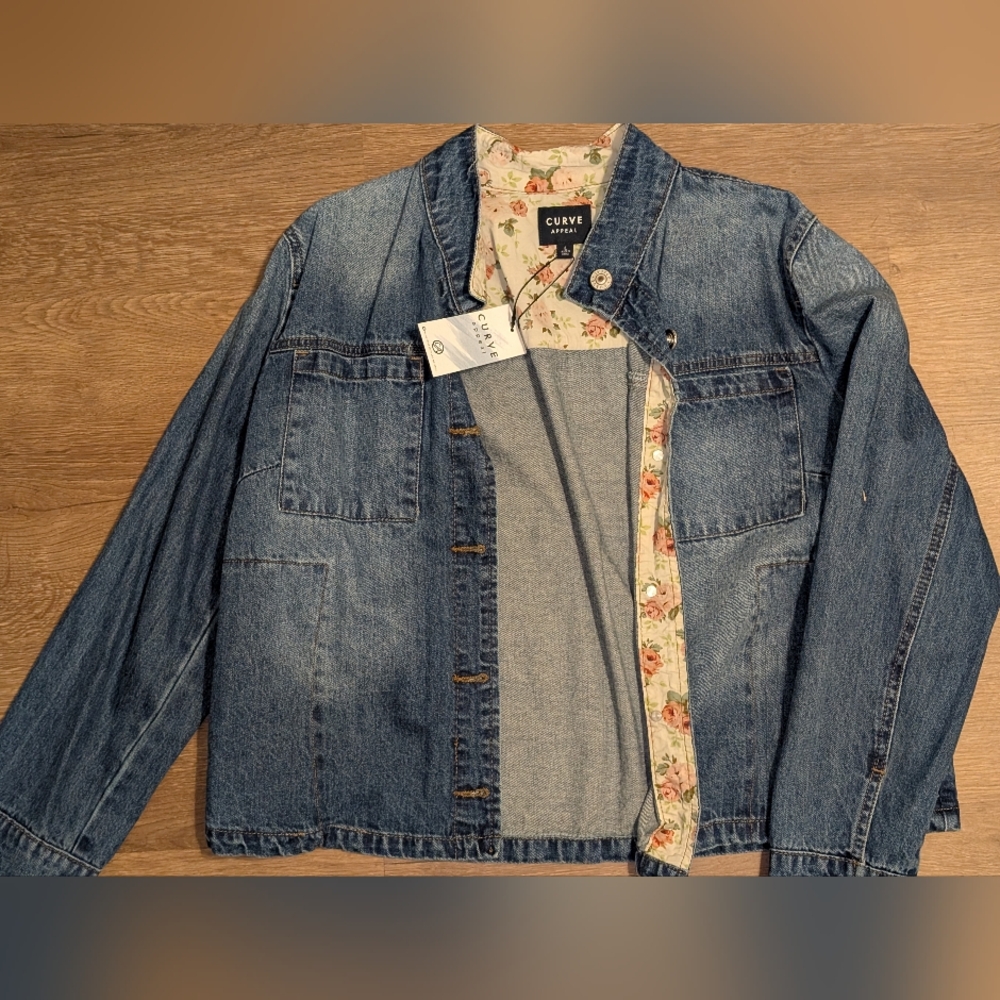Curve Appeal denim shirt-jacket features a floral lining and contrast cuffs. 
